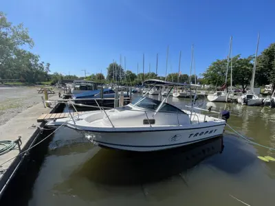 A boat is docked in its slip at the Marina