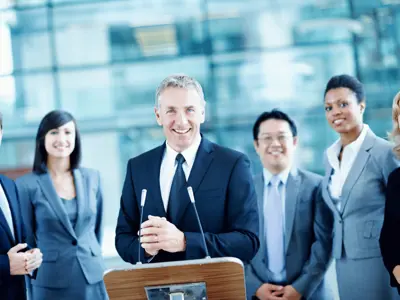 Candidates at podium prepare to speak