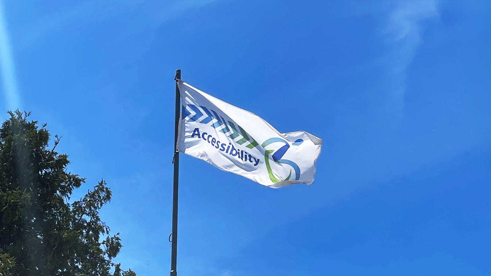 Accessibility flag blows in the wind