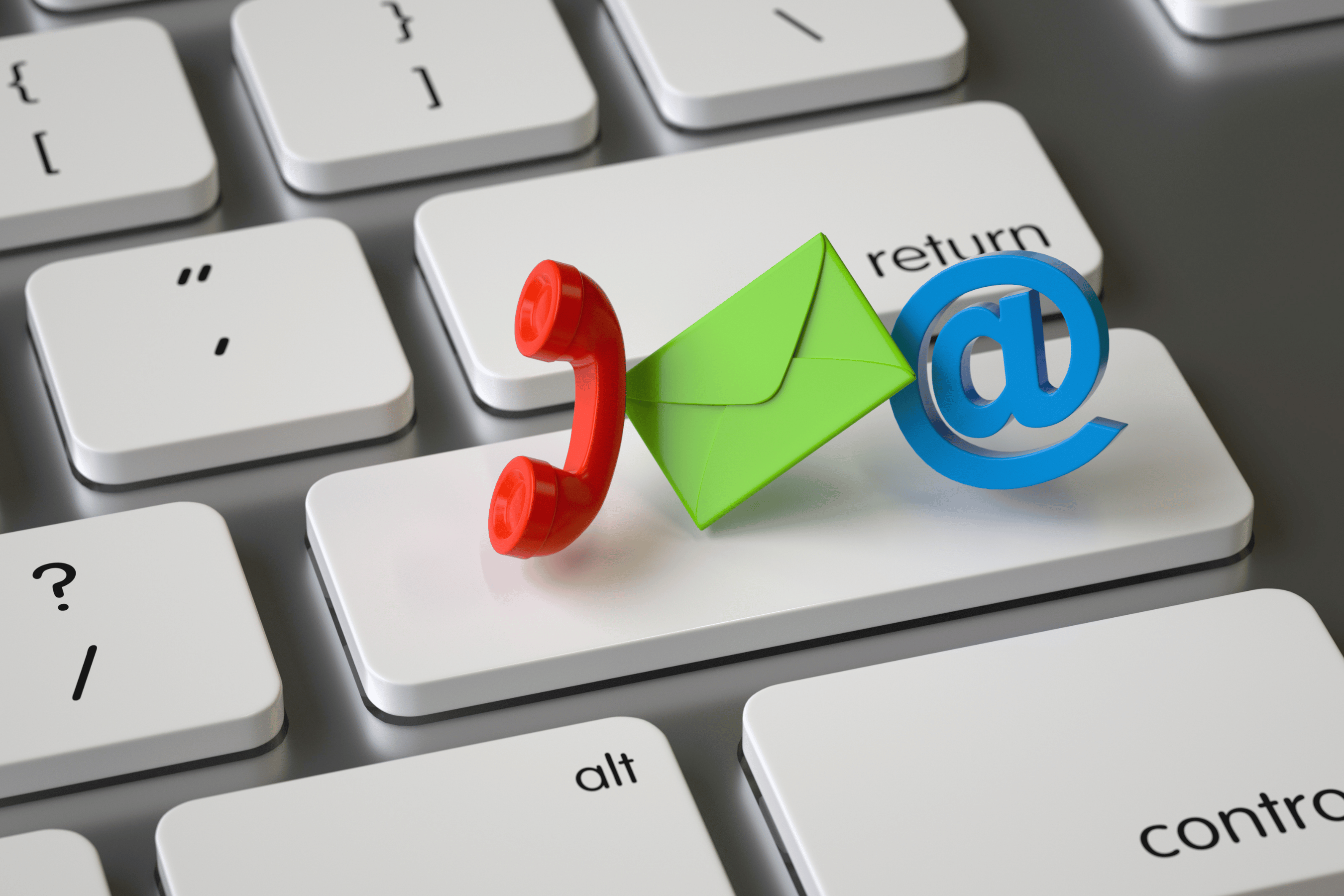 Icons symbolizing contact methods sit on top of a keyboard