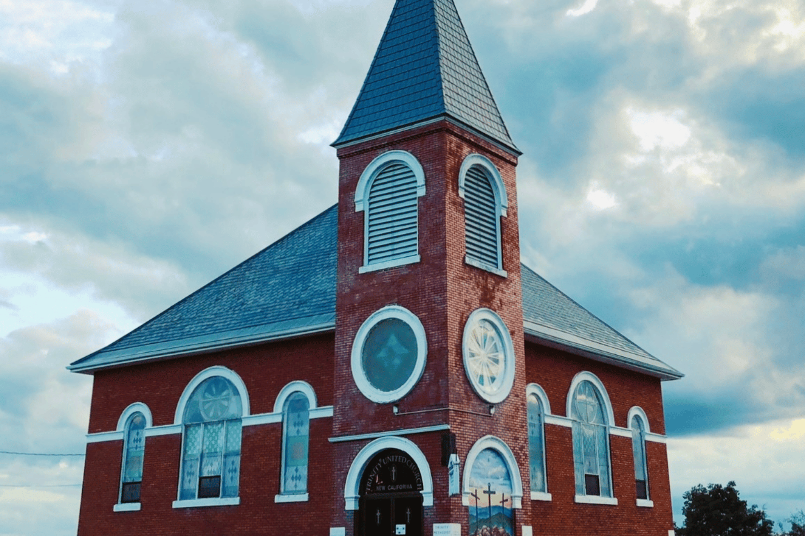 Red brick church with many windows