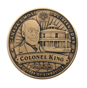 Front of collector coin shows Colonel King in front of Kingsholme
