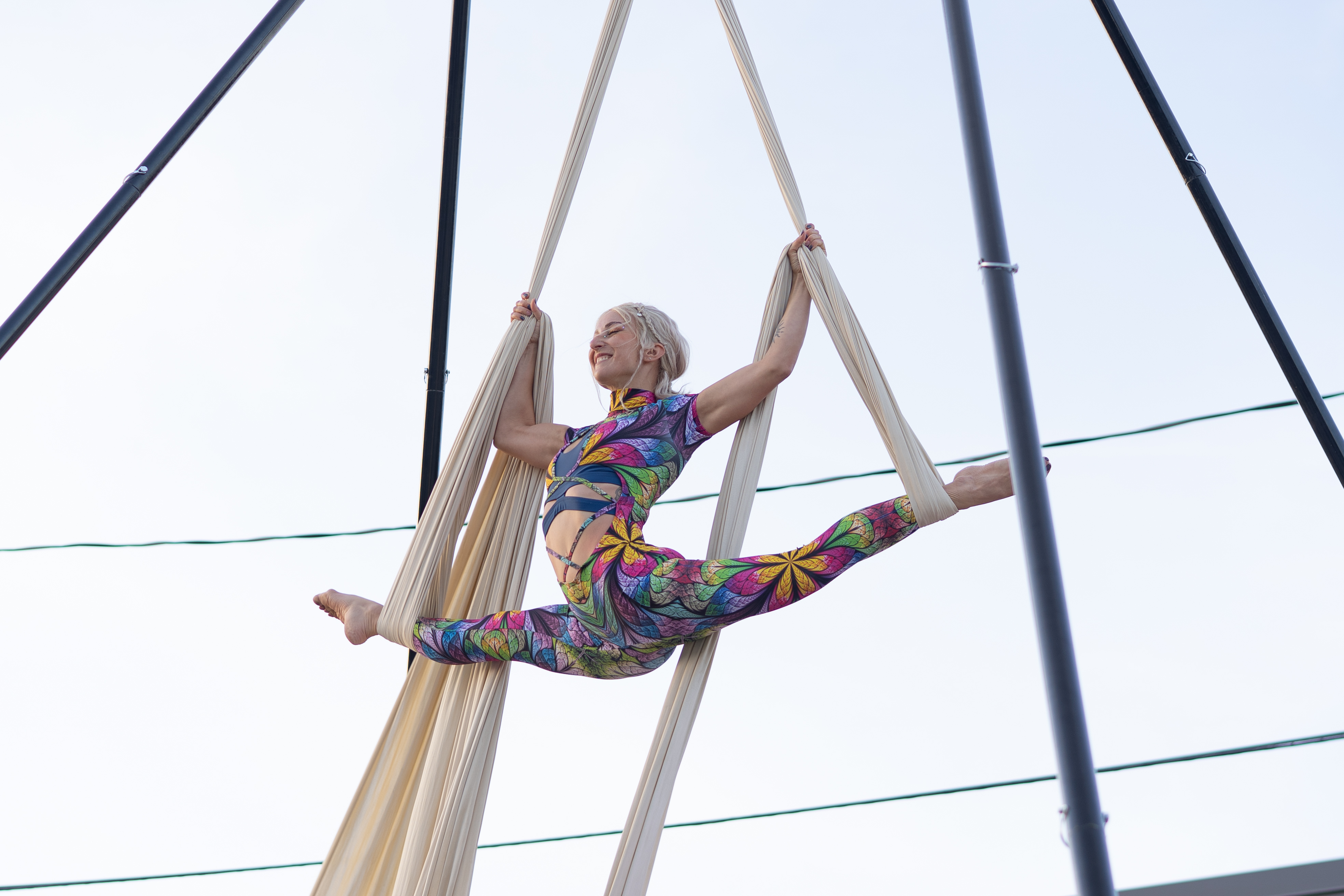 An aerialist performs outside