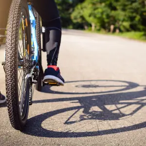 A cyclist bikes along the road