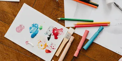 Art supplies and paper on a table