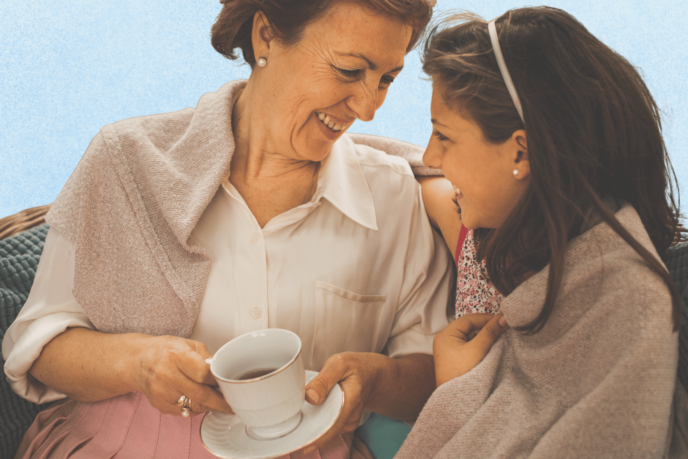 Nana and granddaughter share a laugh and a tea