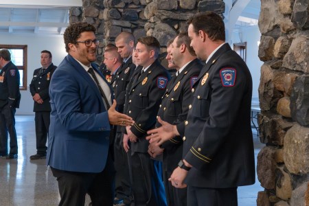 Mayor Dennis Rogers shakes hands with Kingsville Fire Recruit class of 2024
