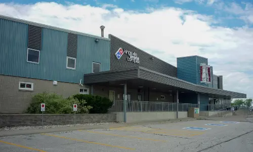 A side view of the Kingsville Arena Complex building