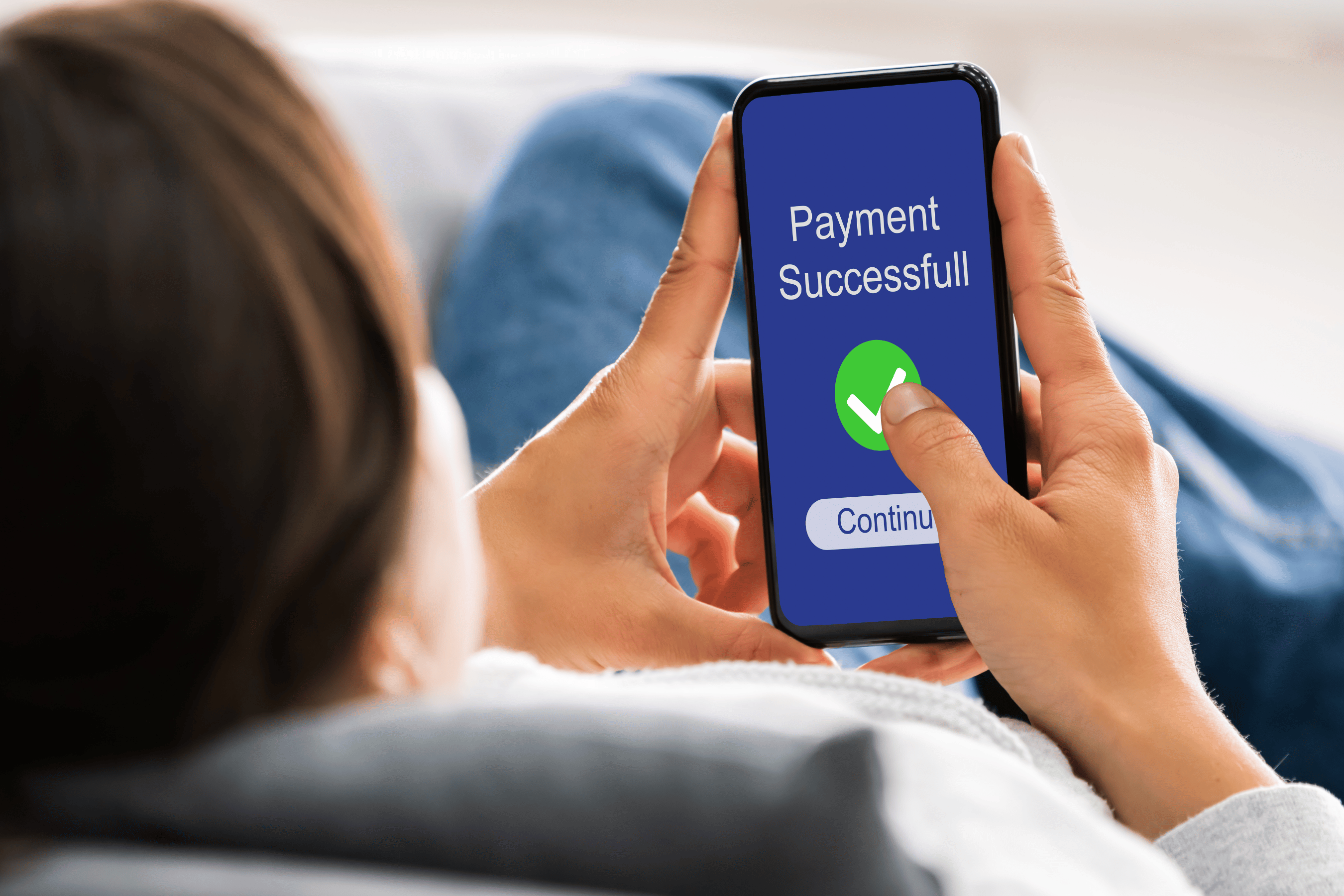 Woman makes a successful payment on her smartphone