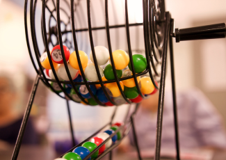 Colourful balls inside a raffle cage