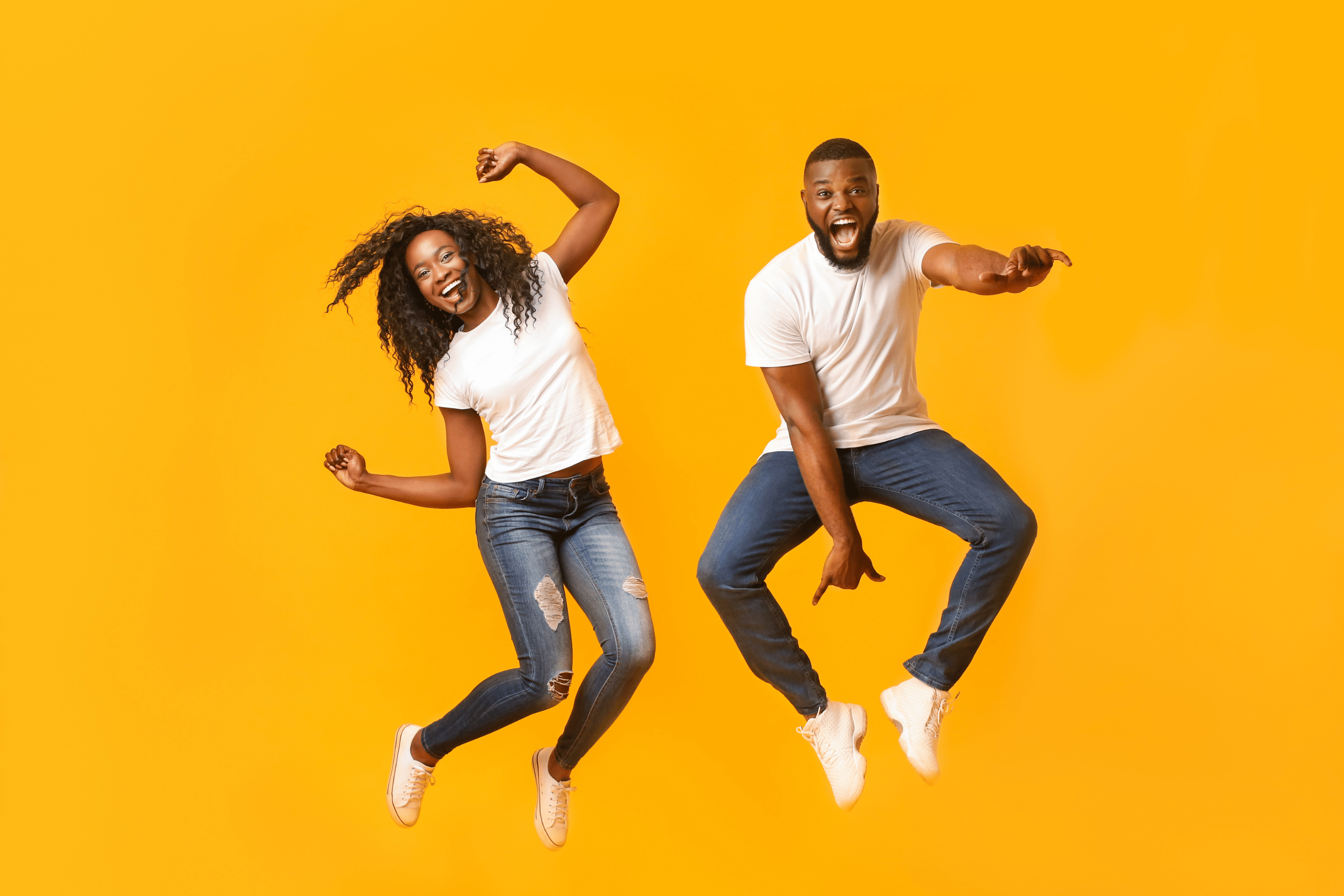 Young couple jumps for joy